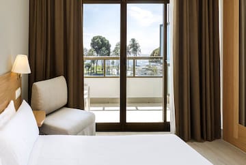 a room with a bed and a glass door