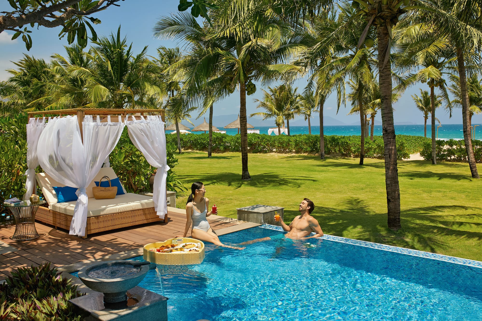 a man and woman in a pool