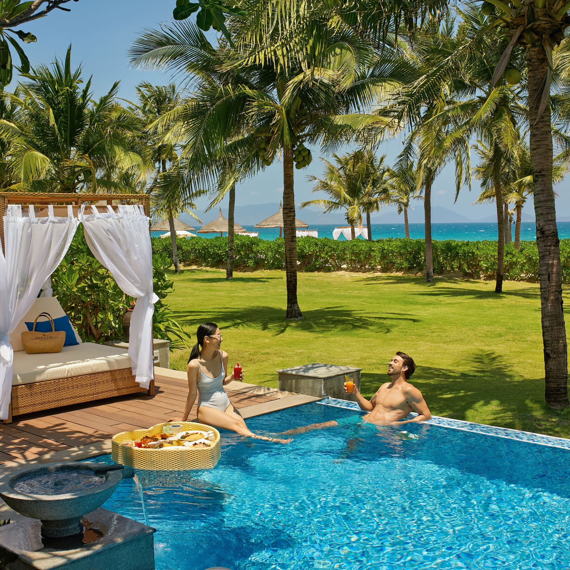 a man and woman in a pool