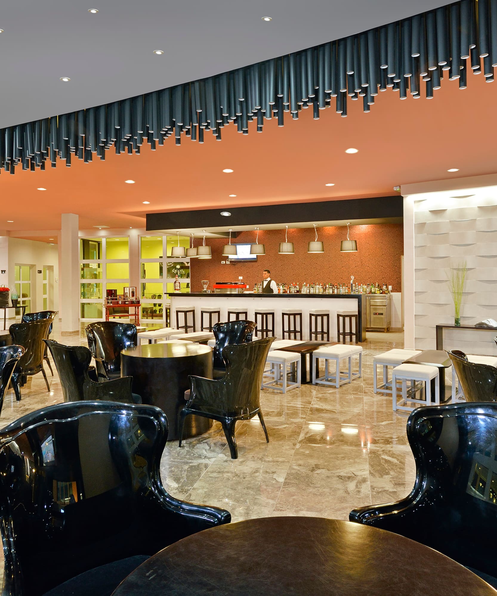 a room with black chairs and tables