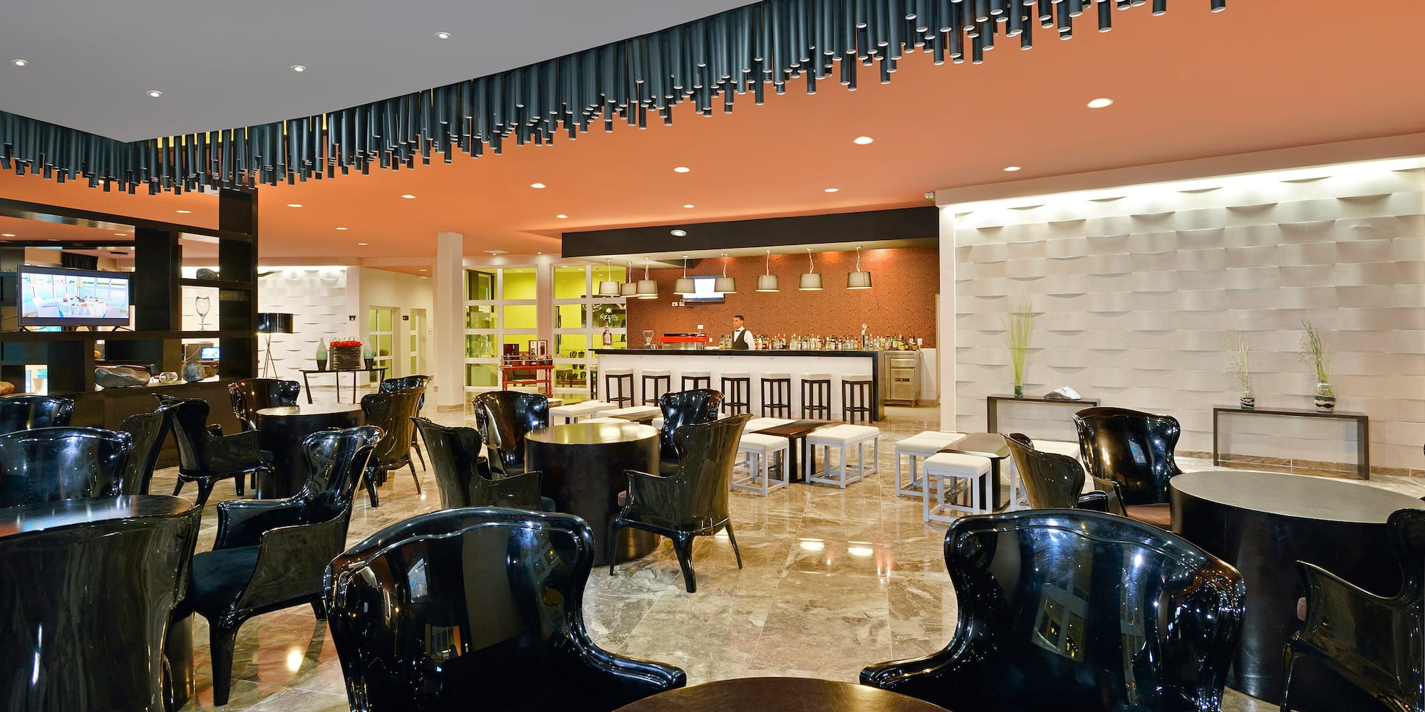 a room with black chairs and tables