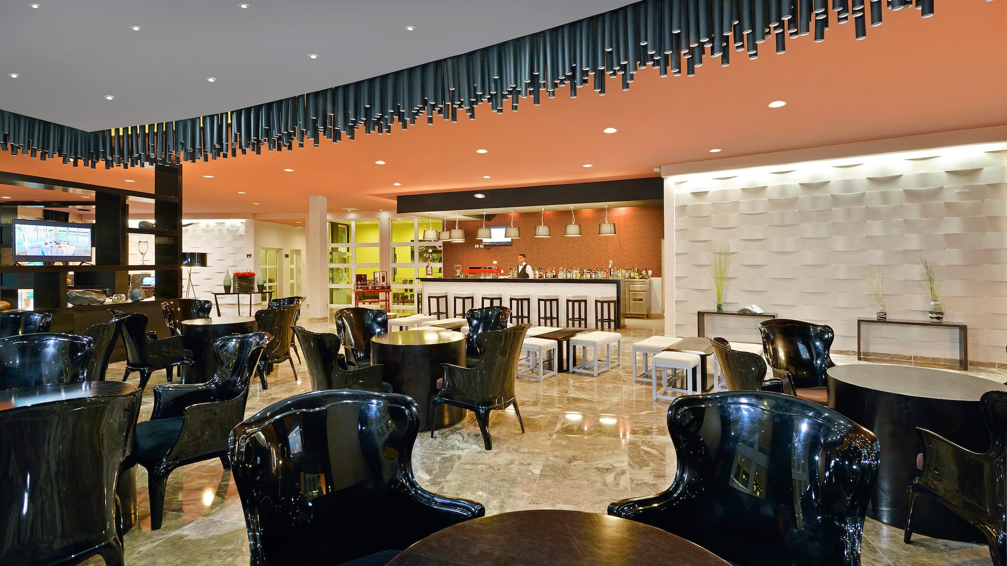 a room with black chairs and tables