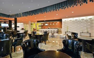 a room with black chairs and tables