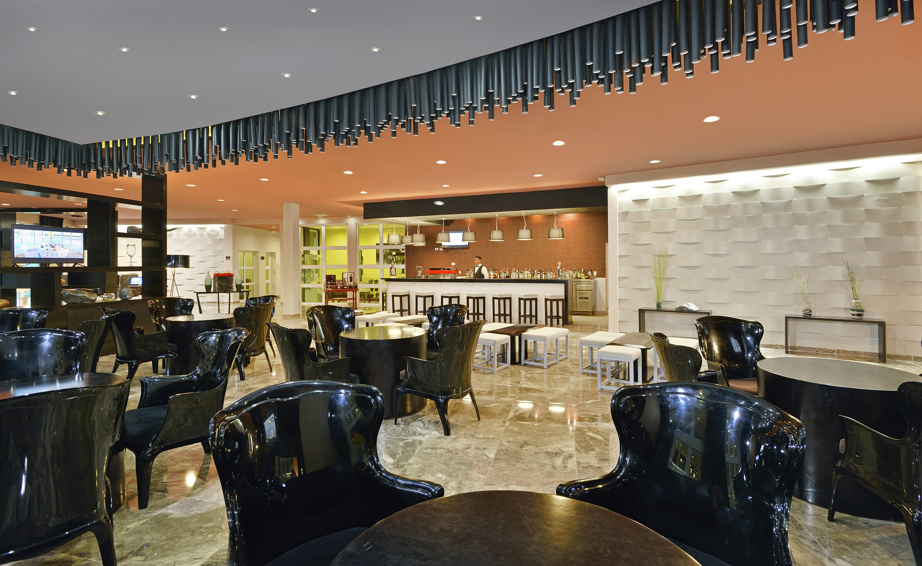 a room with black chairs and tables