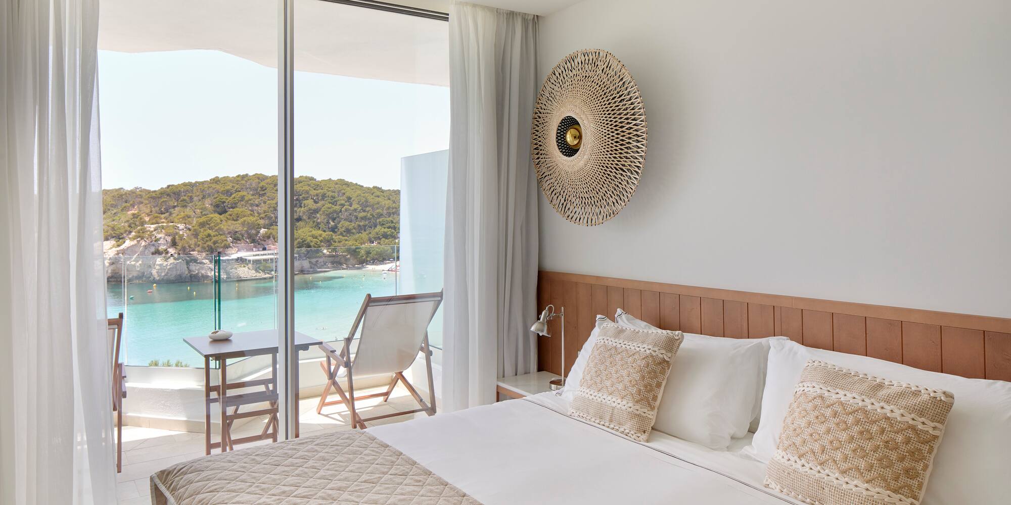 a bed with a view of the ocean