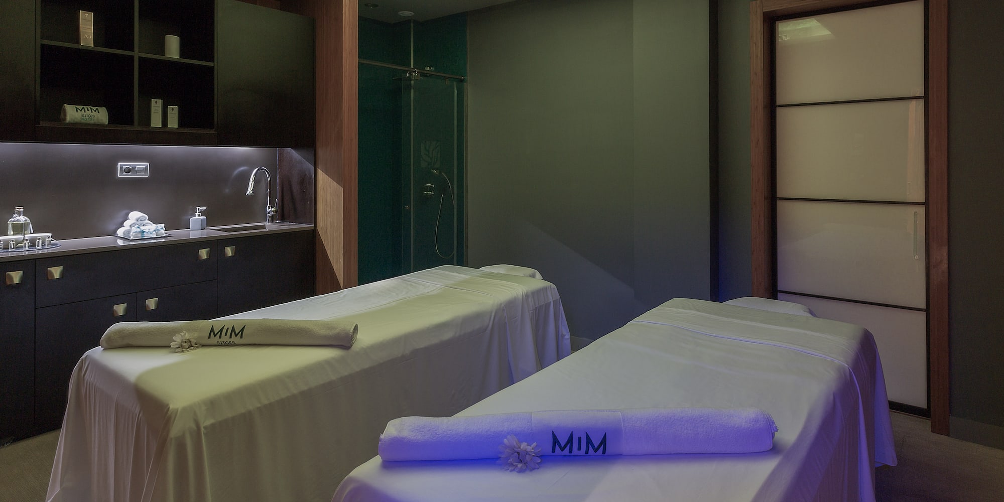 a room with beds and towels