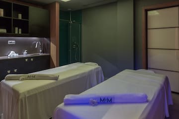 a room with beds and towels