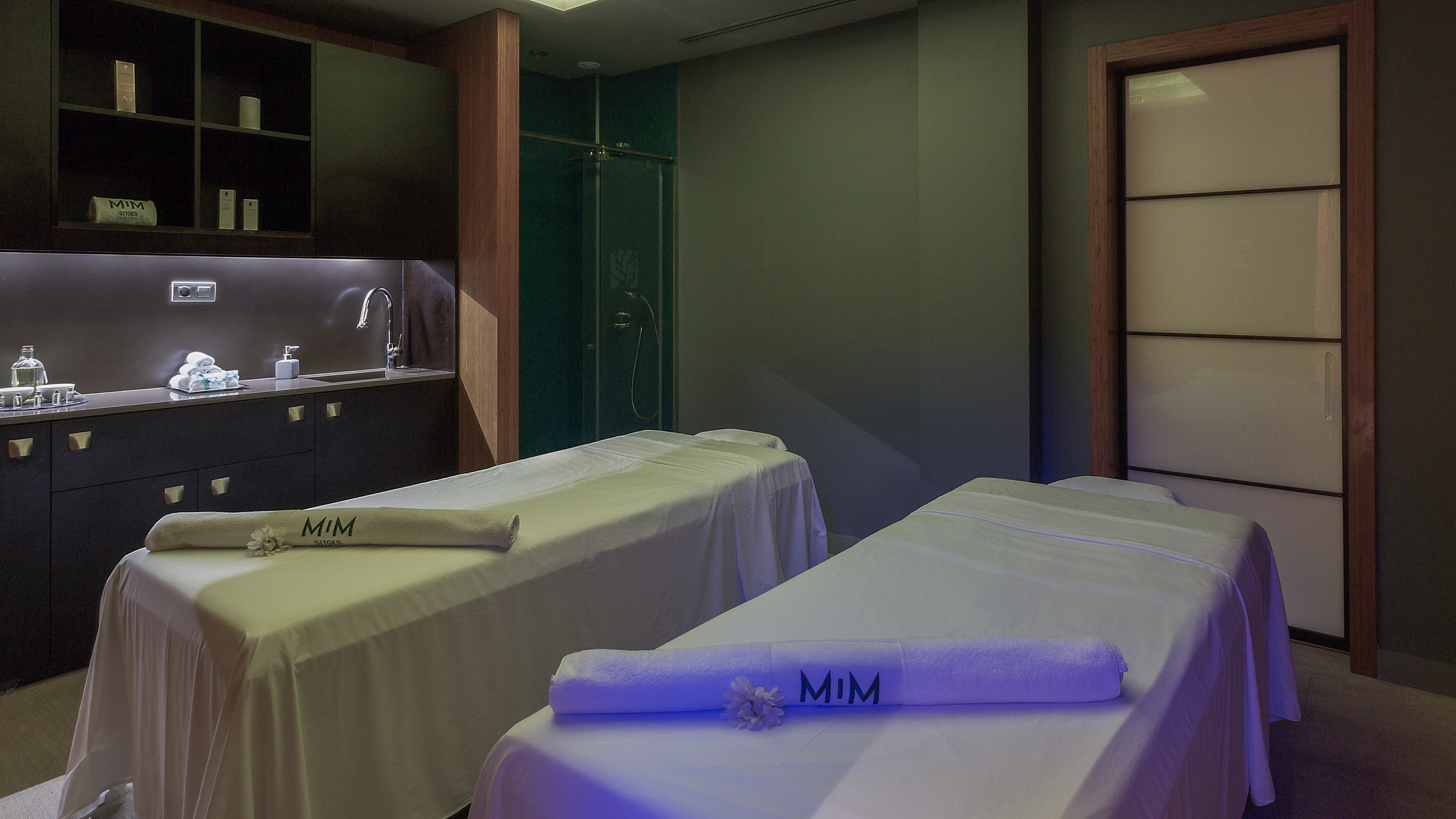 a room with beds and towels