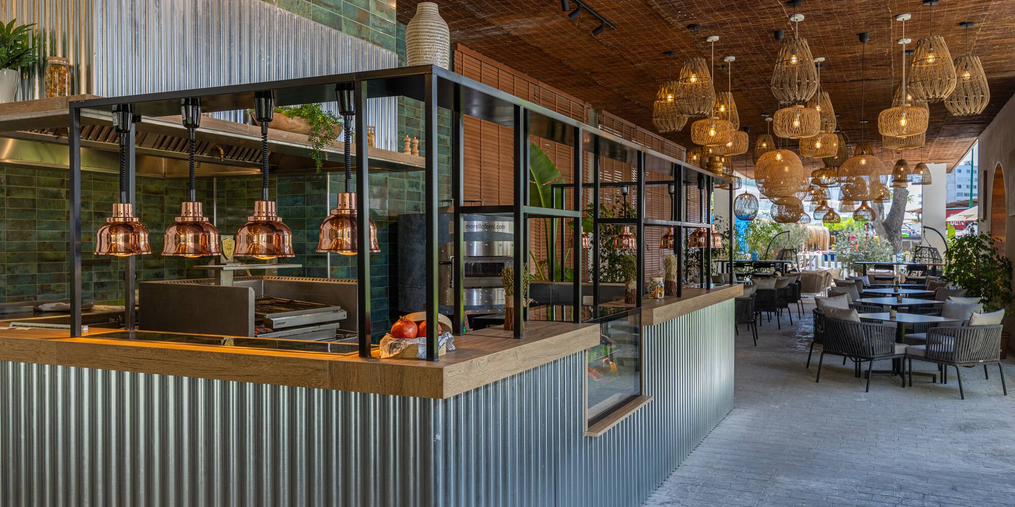 a restaurant with a bar and chairs