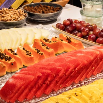 a table with different fruits and nuts