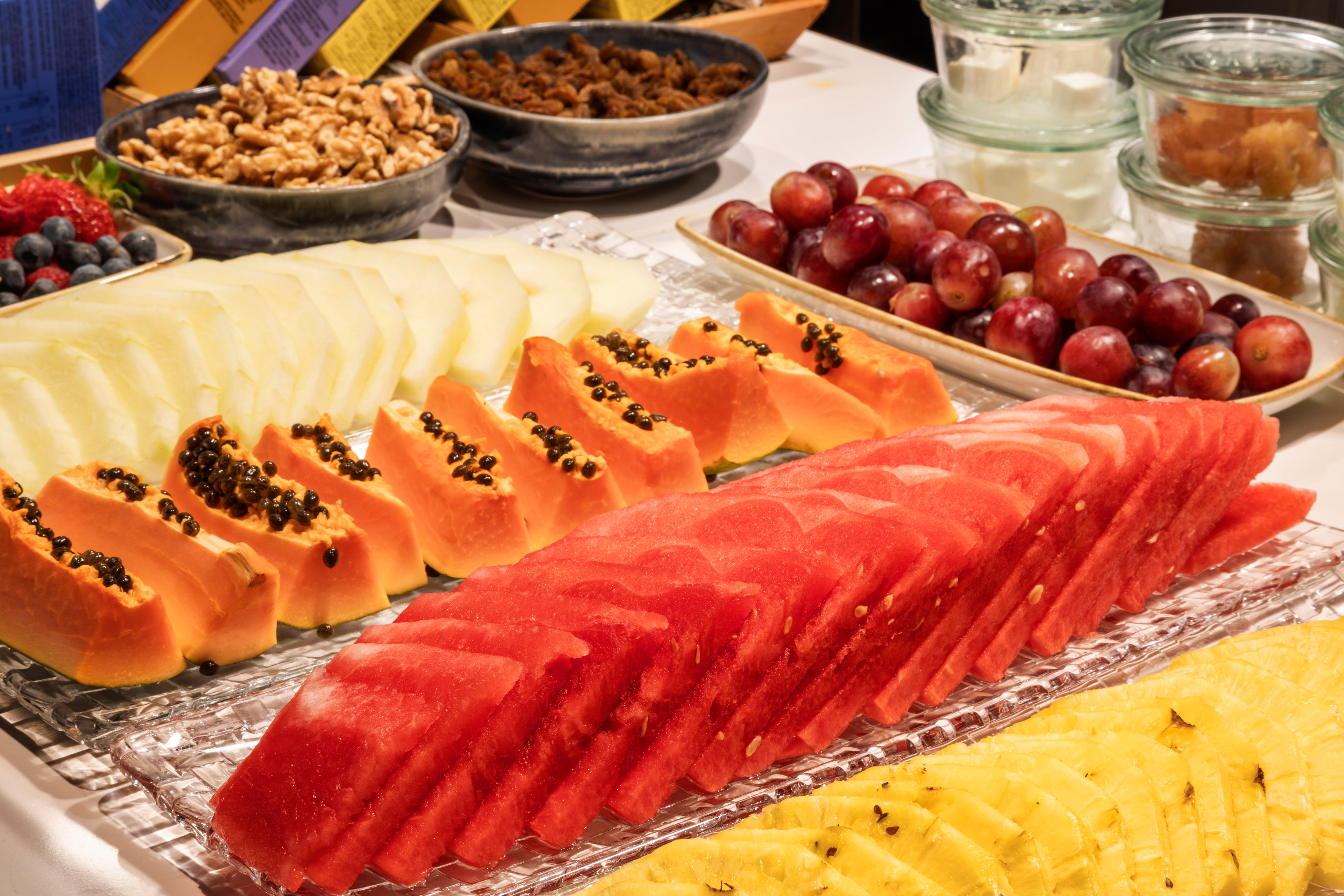 a table with different fruits and nuts