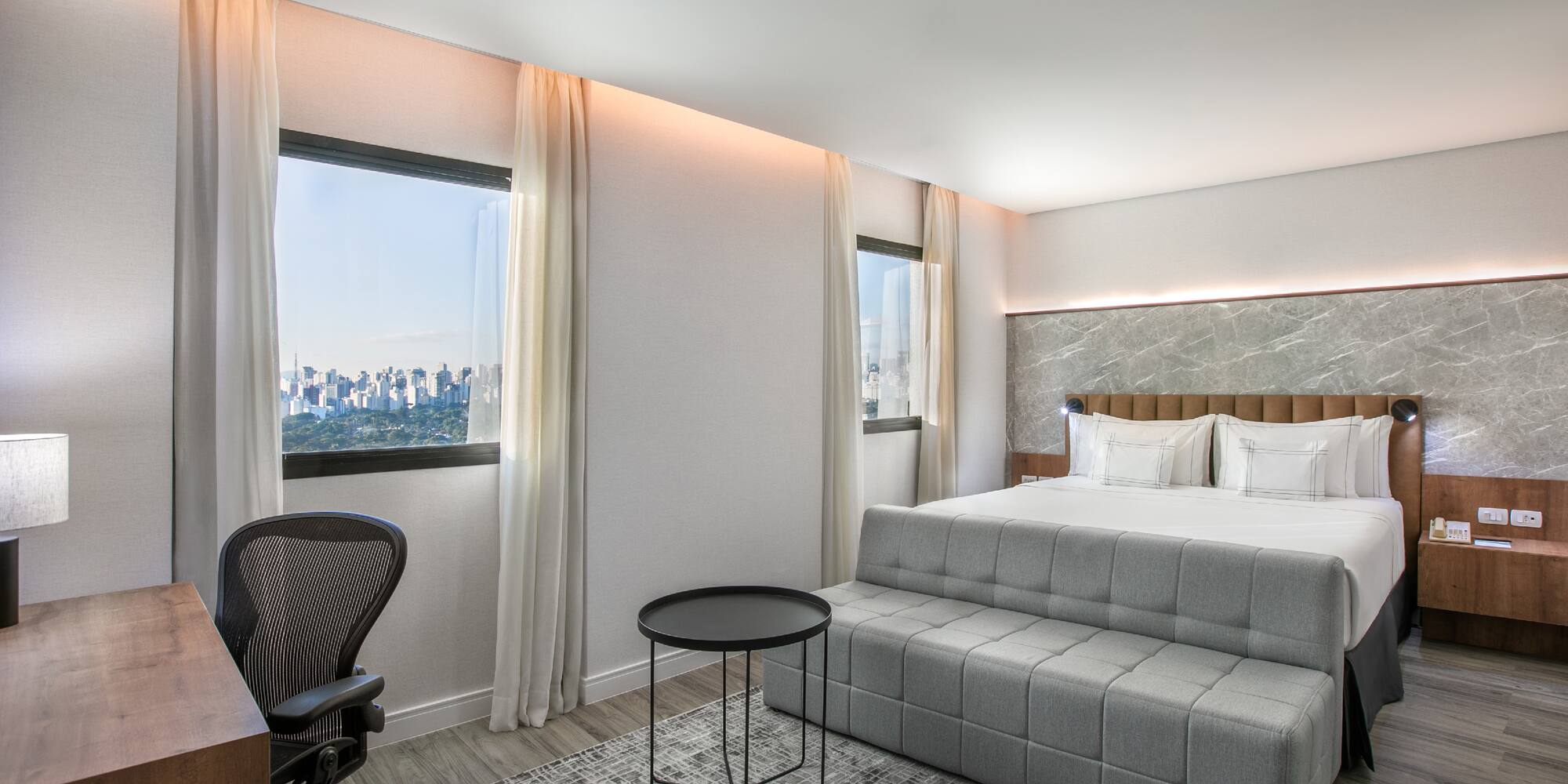 a room with a bed and a desk