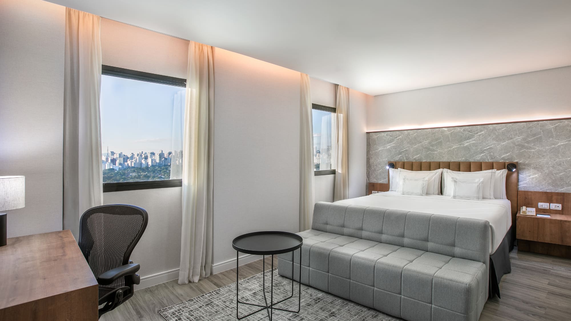 a room with a bed and a desk