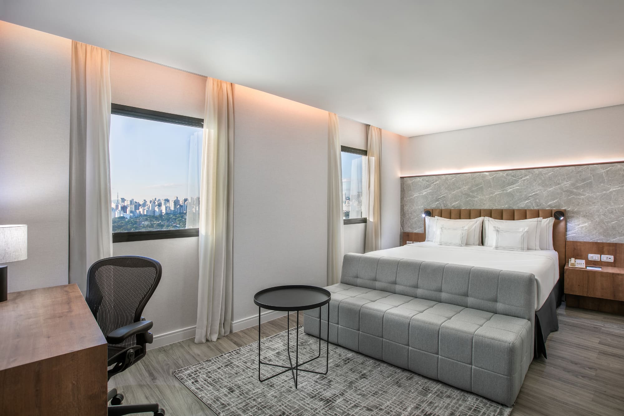 a room with a bed and a desk