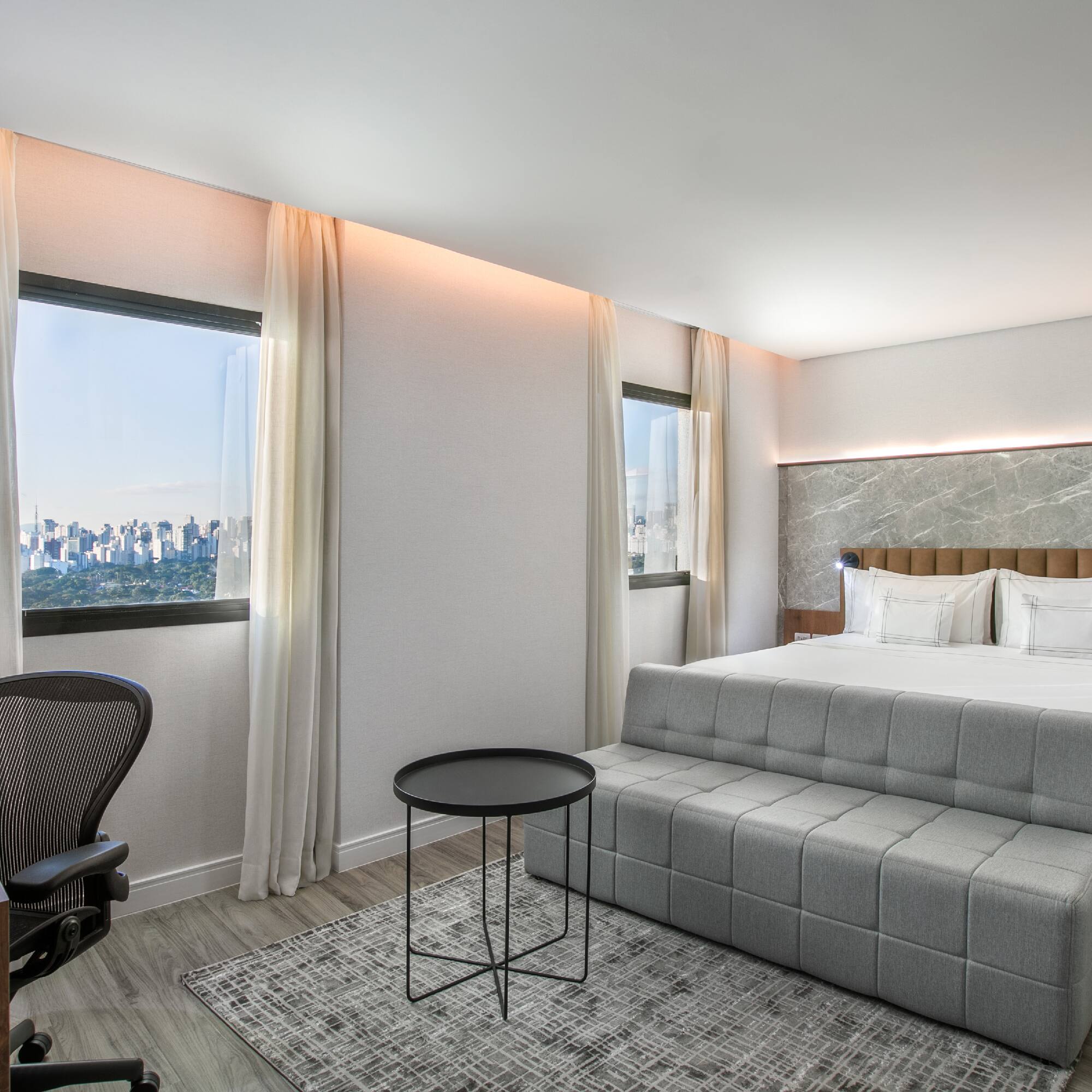 a room with a bed and a desk