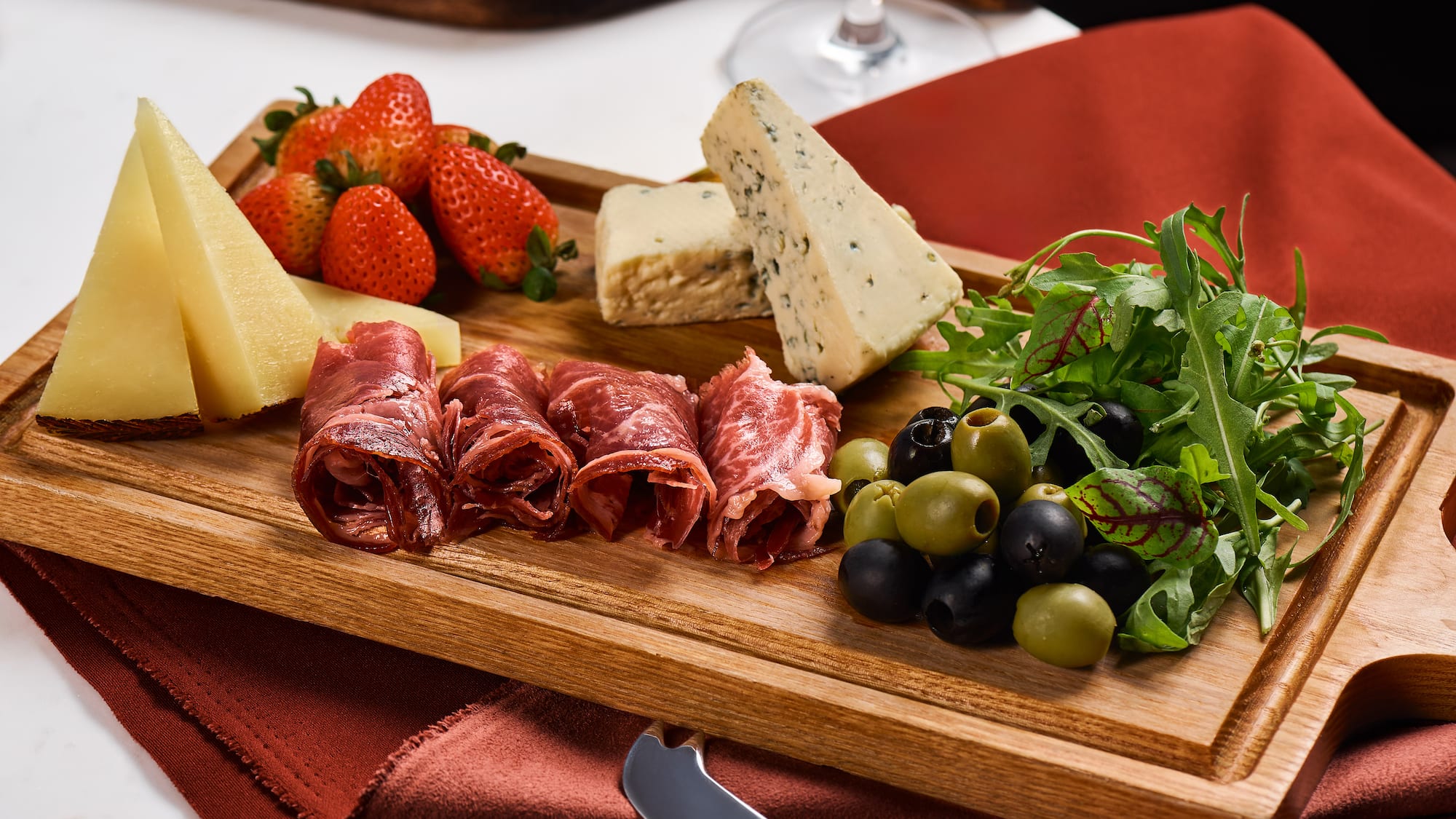a wooden board with food on it