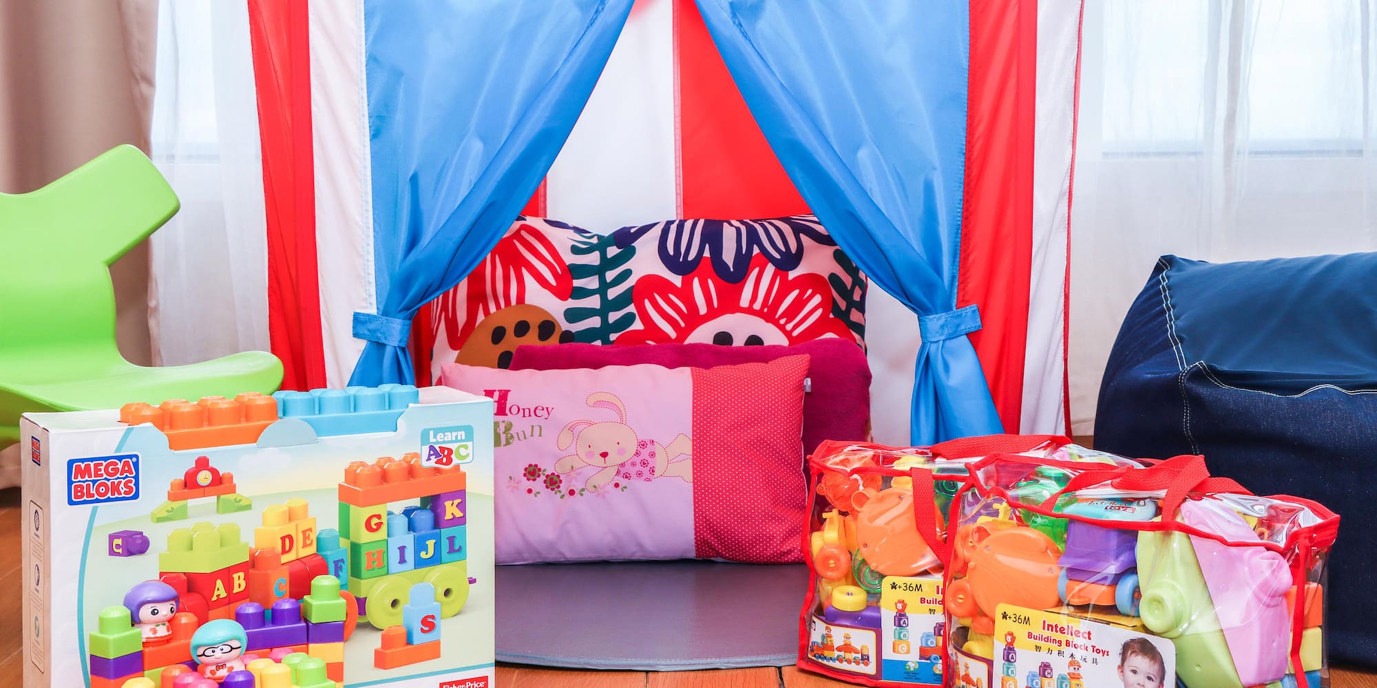 a child's room with a tent and toys