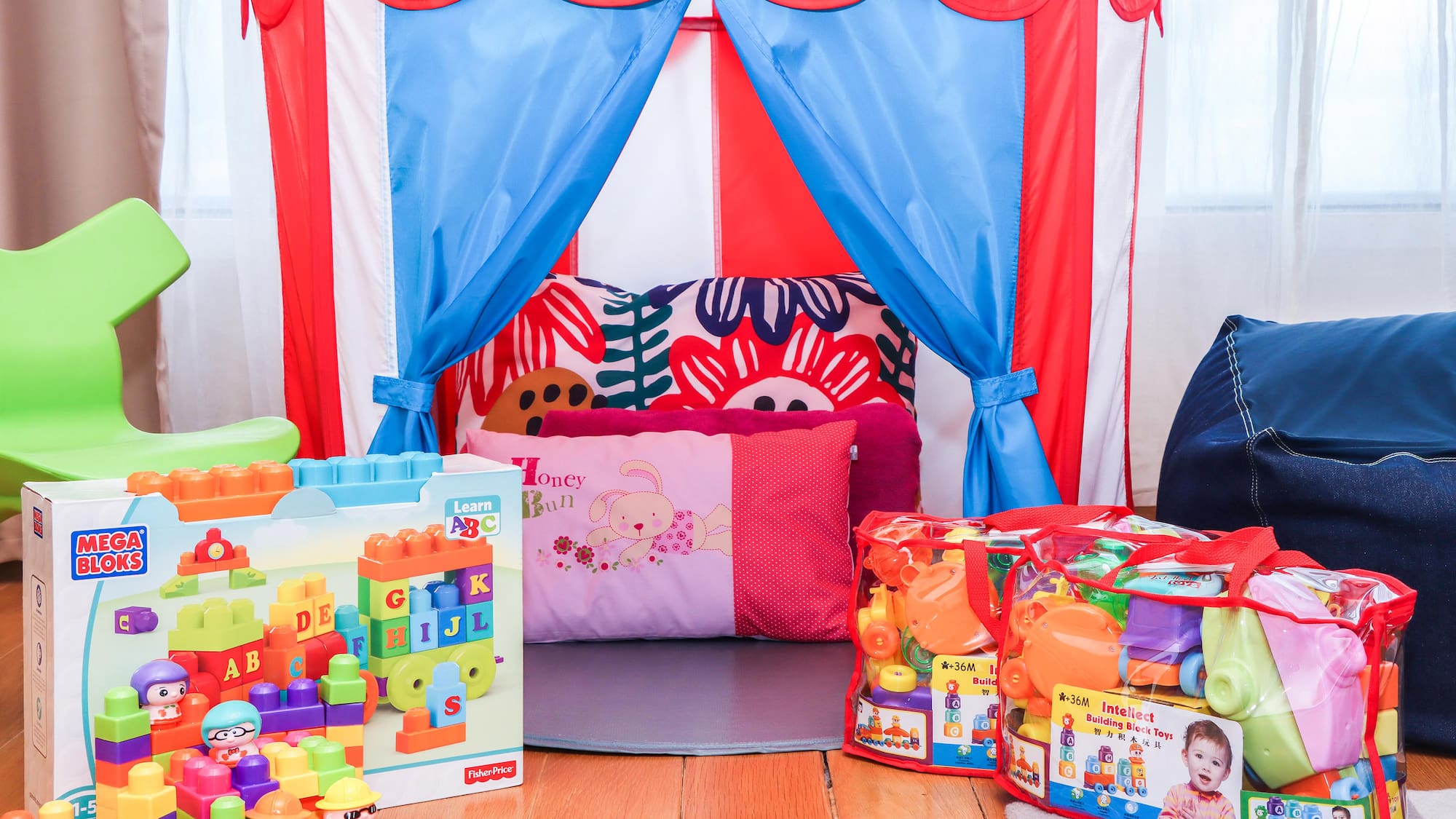 a child's room with a tent and toys