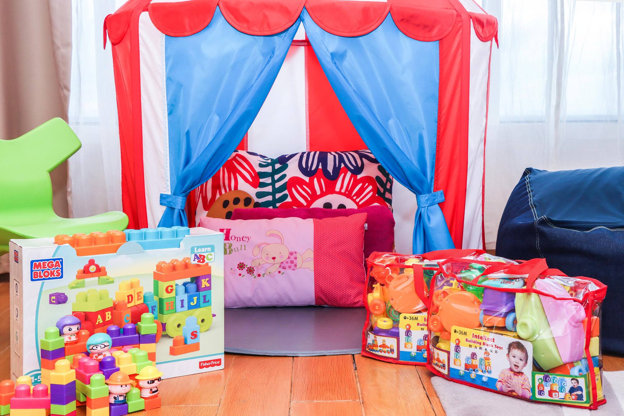 a child's room with a tent and toys