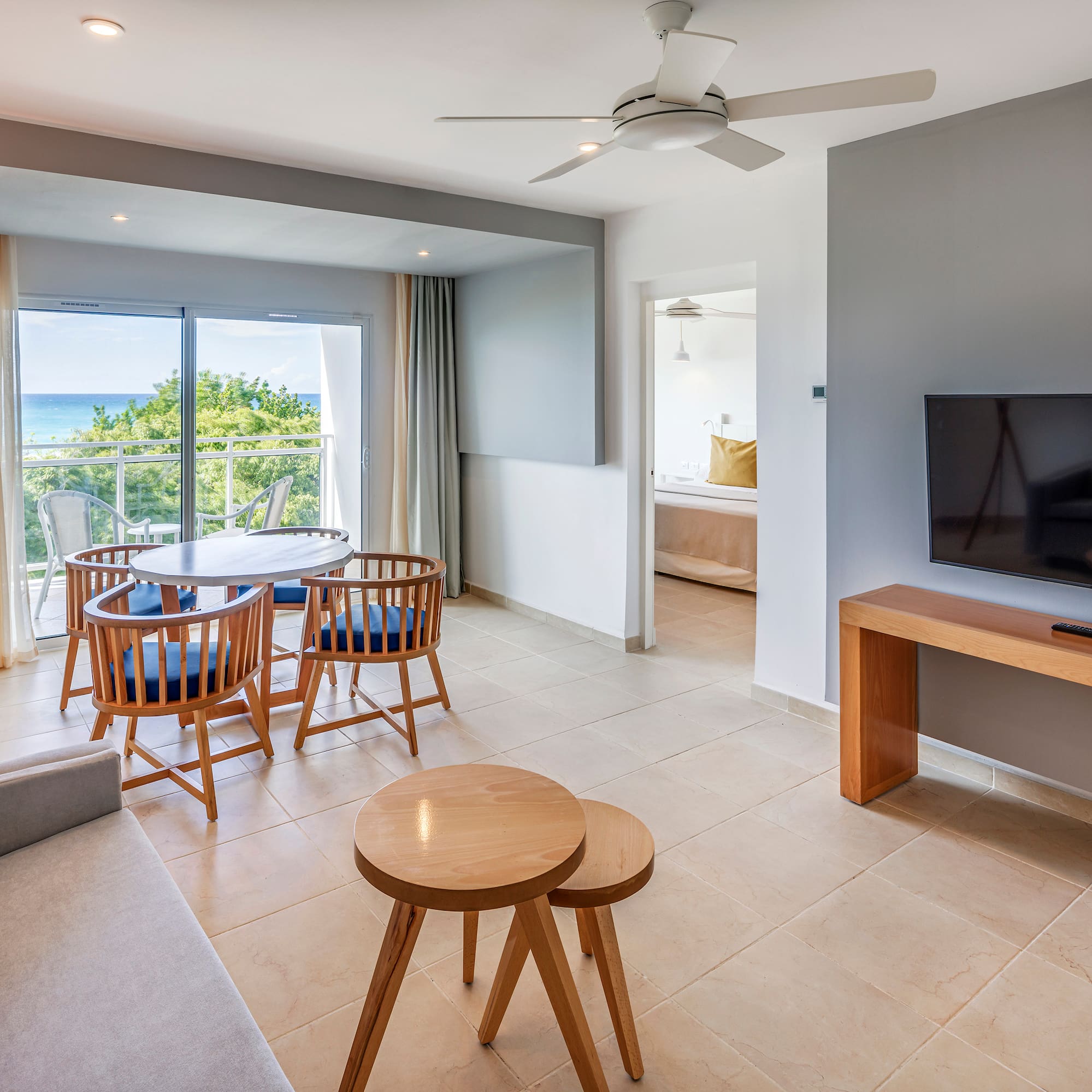 a living room with a television and a table