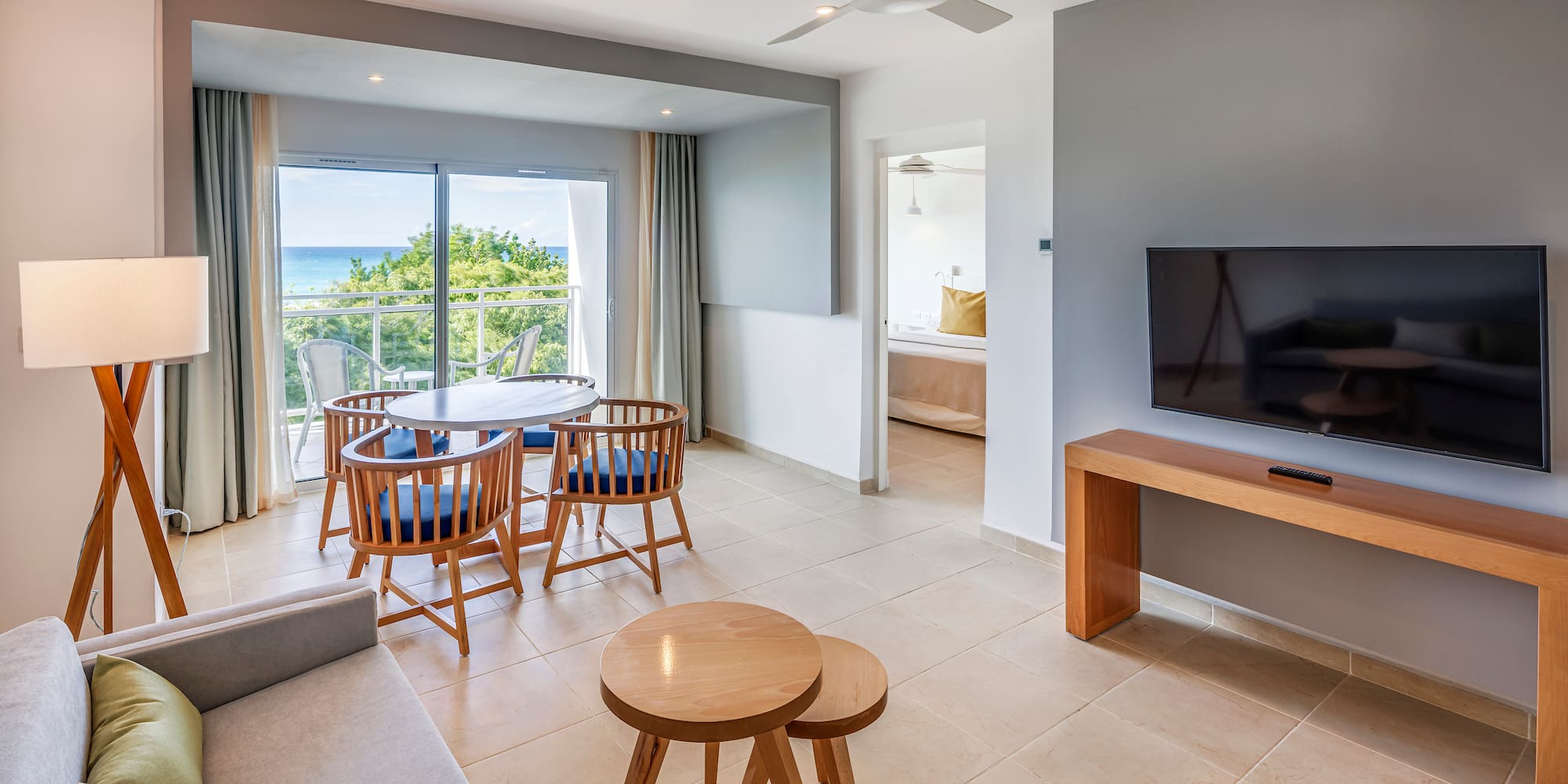 a living room with a television and a table