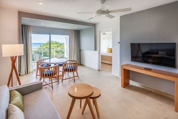 a living room with a television and a table