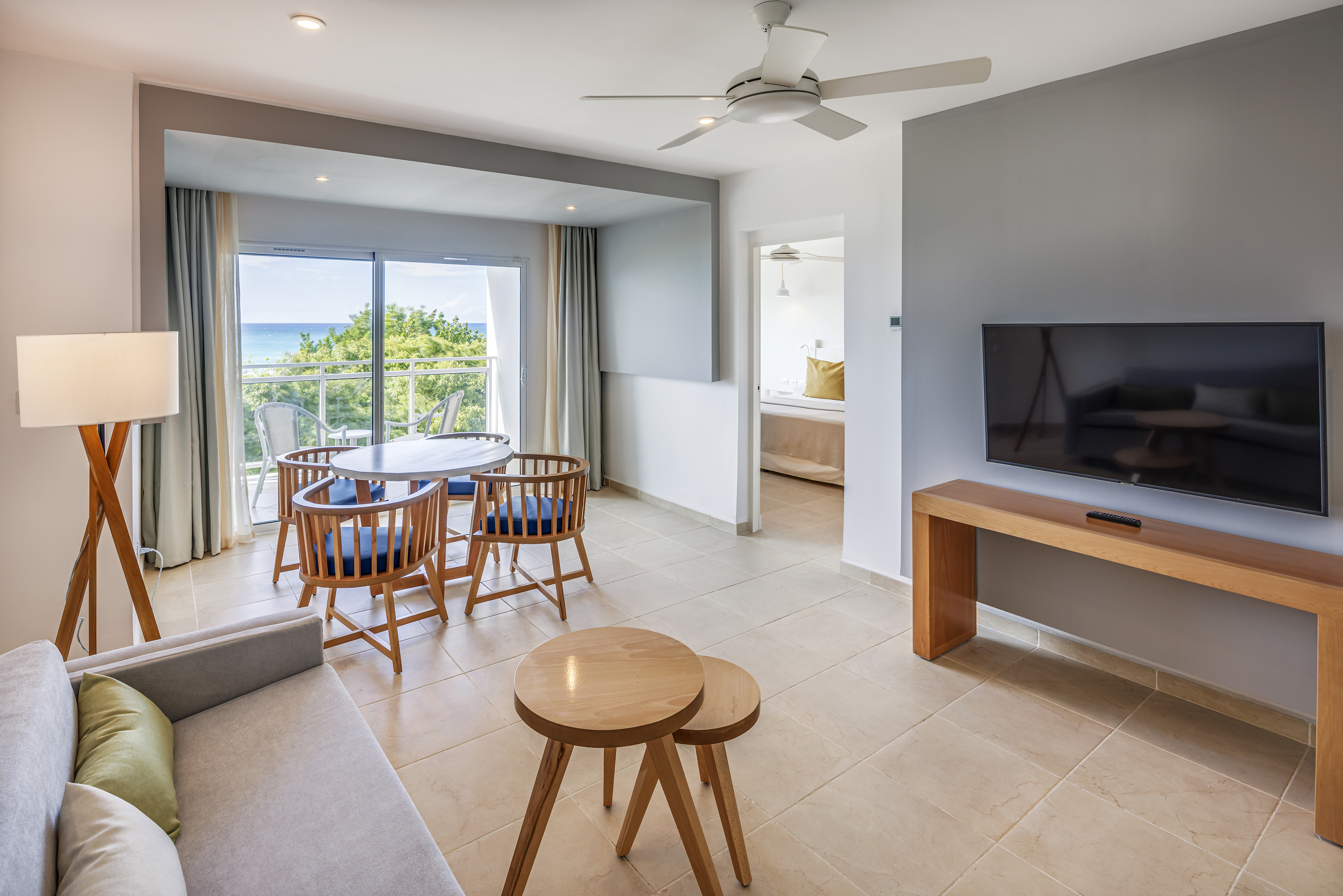 a living room with a television and a table