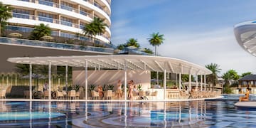 a pool with a building and people in the background