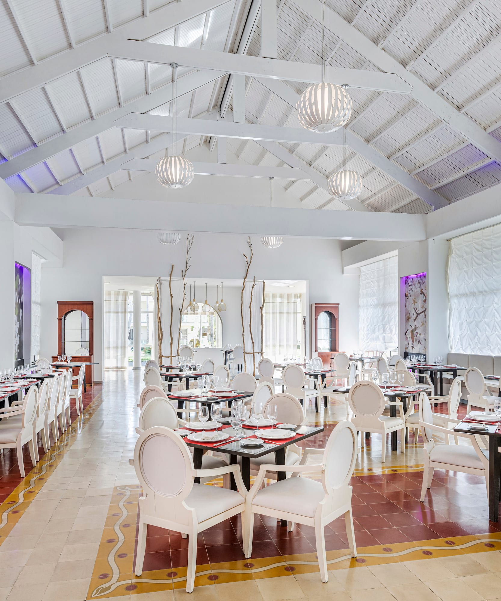 a room with tables and chairs