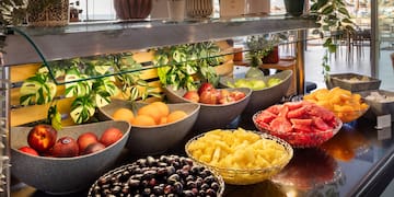 a group of bowls of fruit