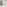 Bright hotel room with white bed, balcony, sea view, beach, and mountains.
