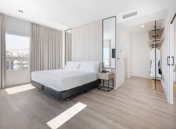 a room with a bed and a mirror