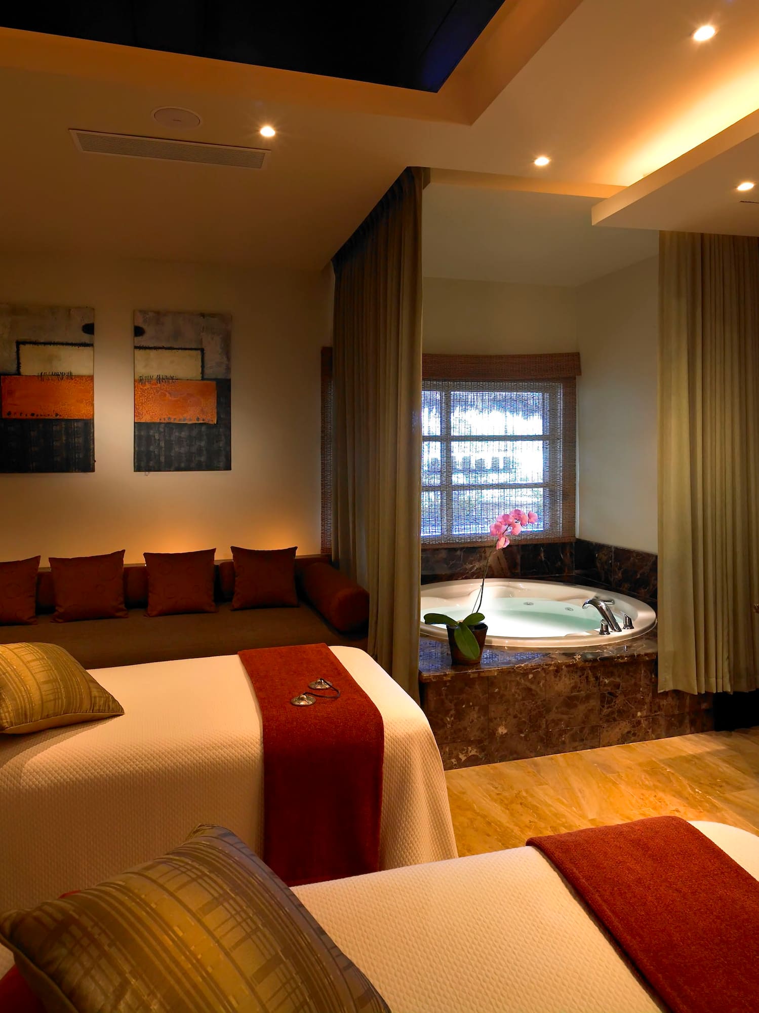 a room with two beds and a jacuzzi