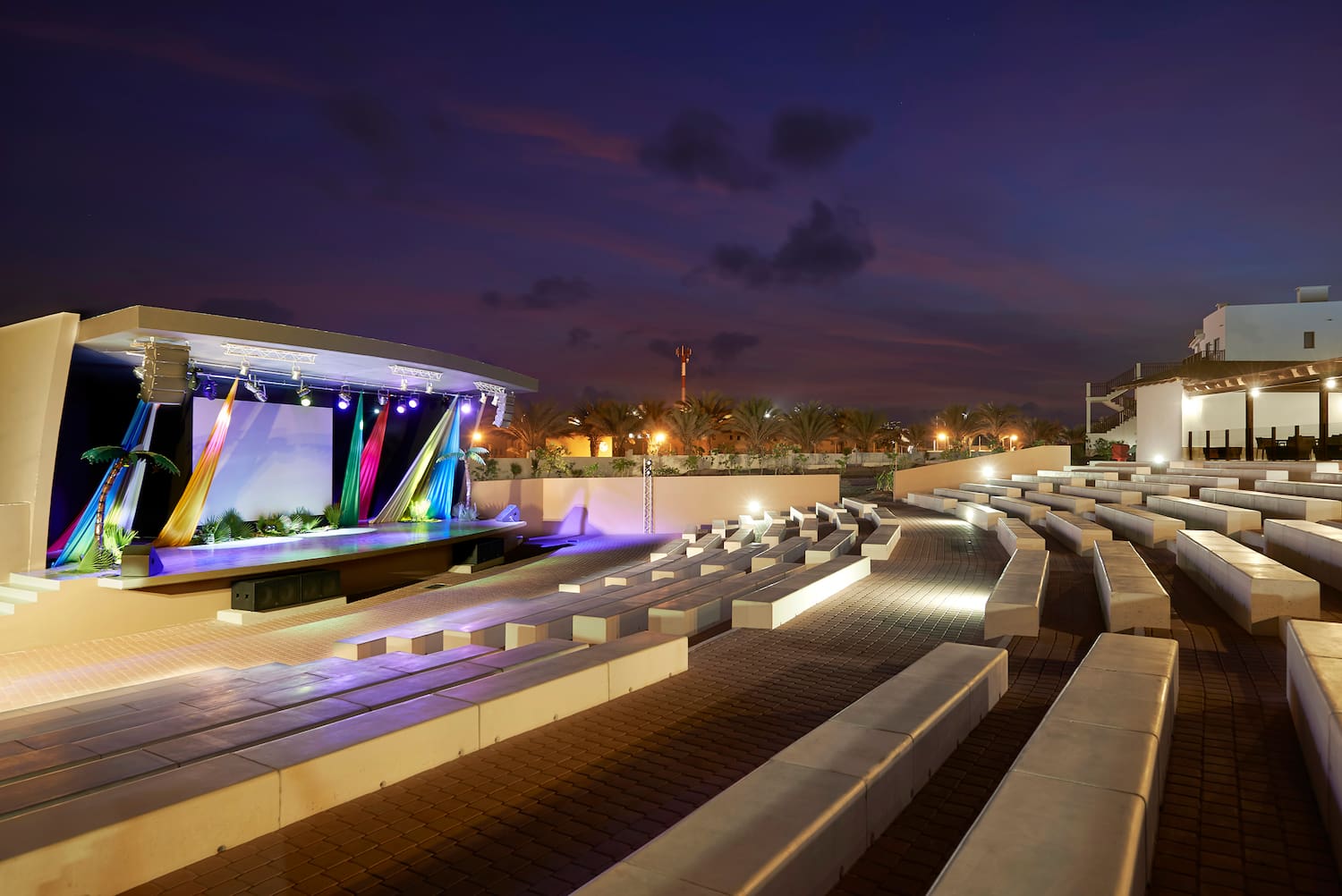 a outdoor stage with lights and seating