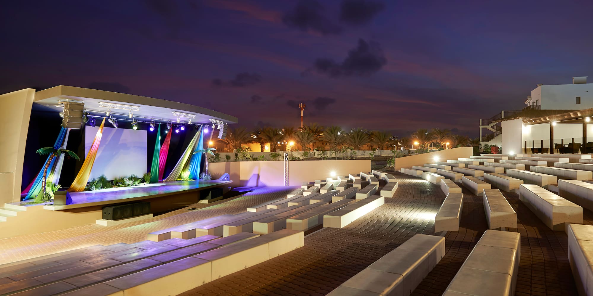 a outdoor stage with lights and seating