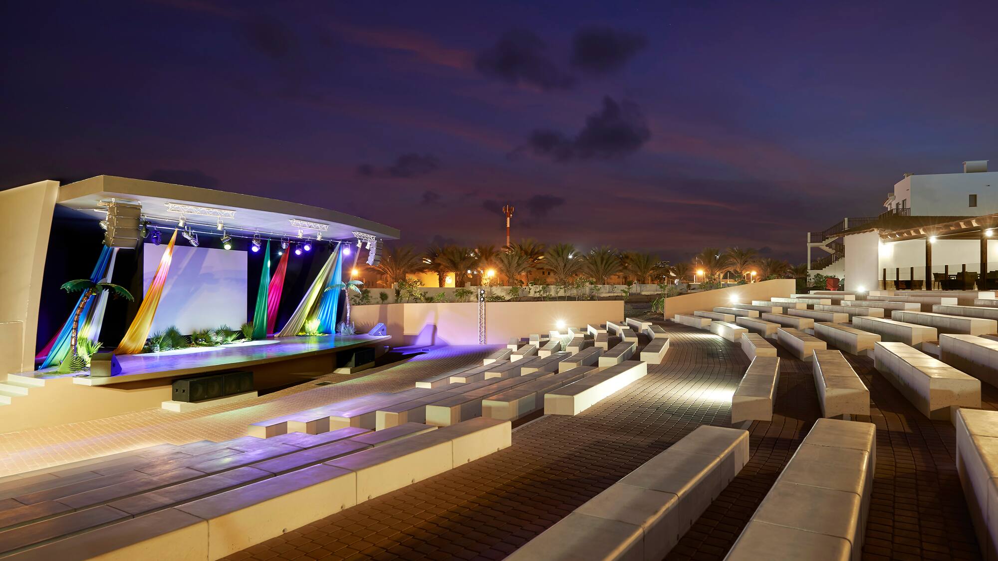a outdoor stage with lights and seating