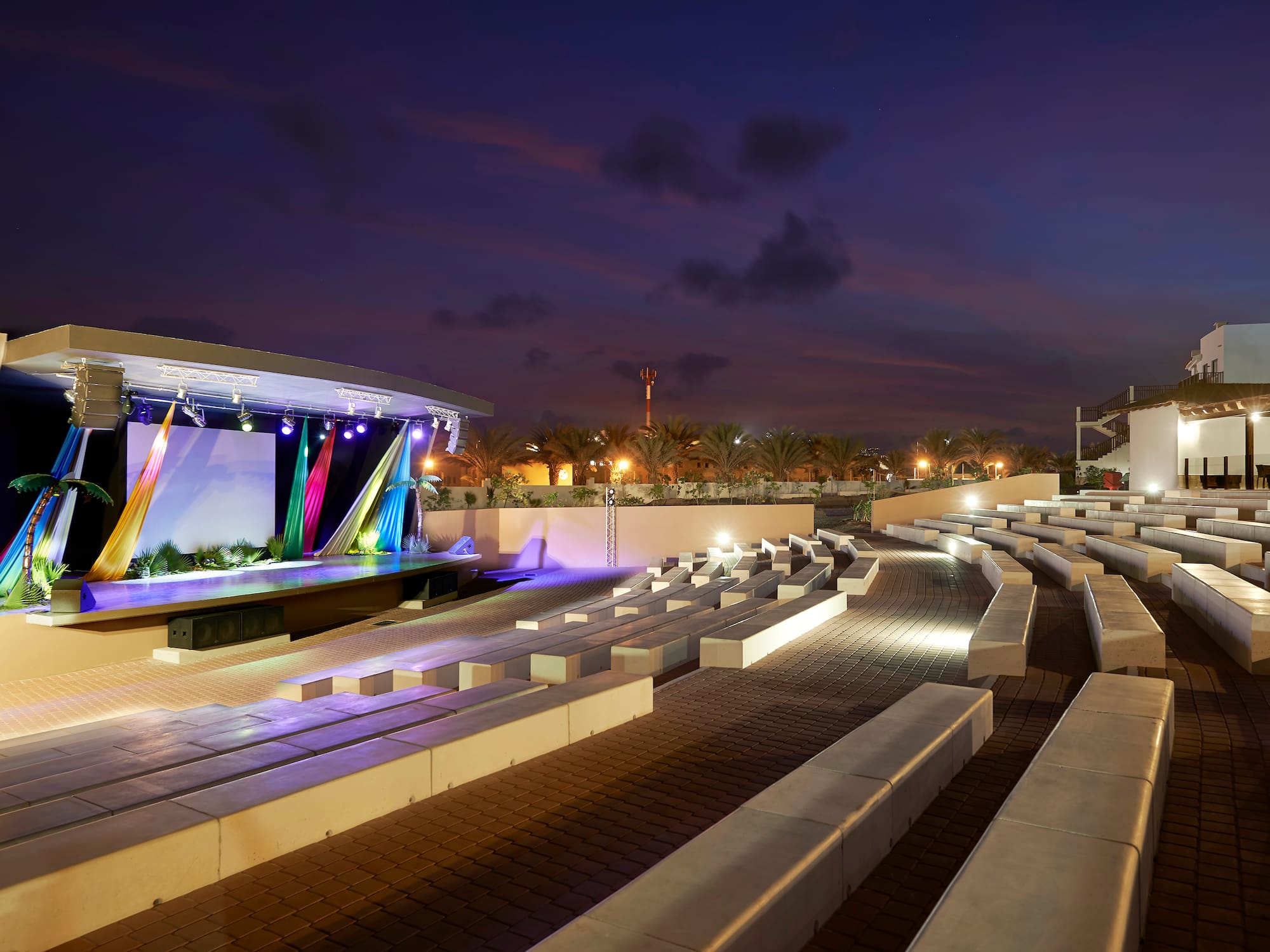 a outdoor stage with lights and seating