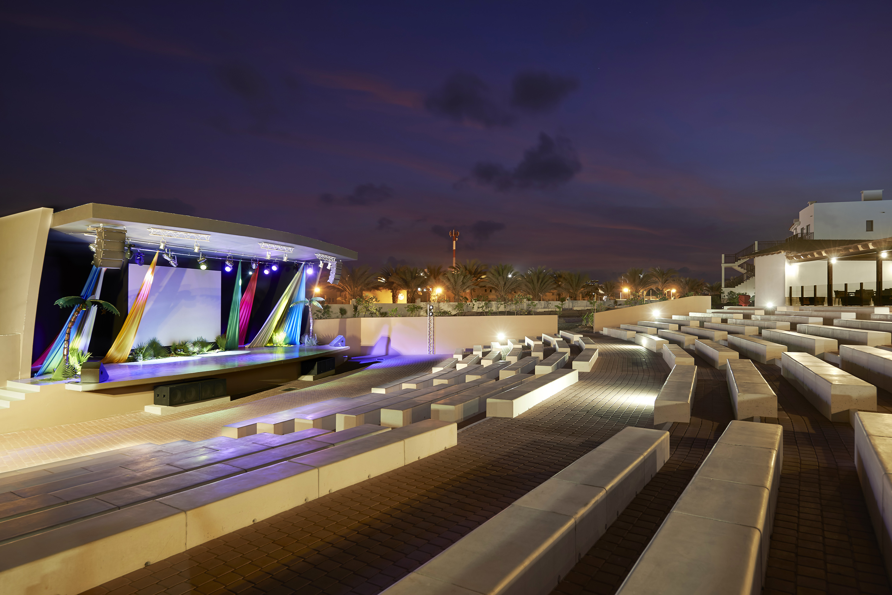 a outdoor stage with lights and seating