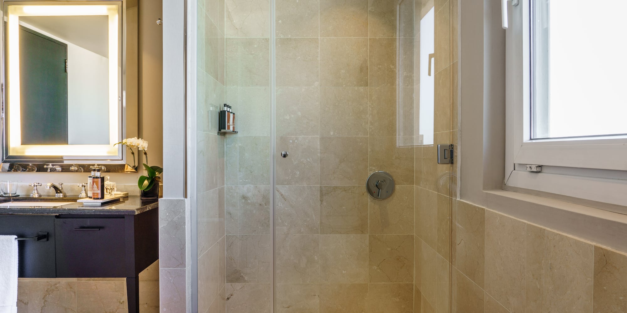 a shower with glass doors