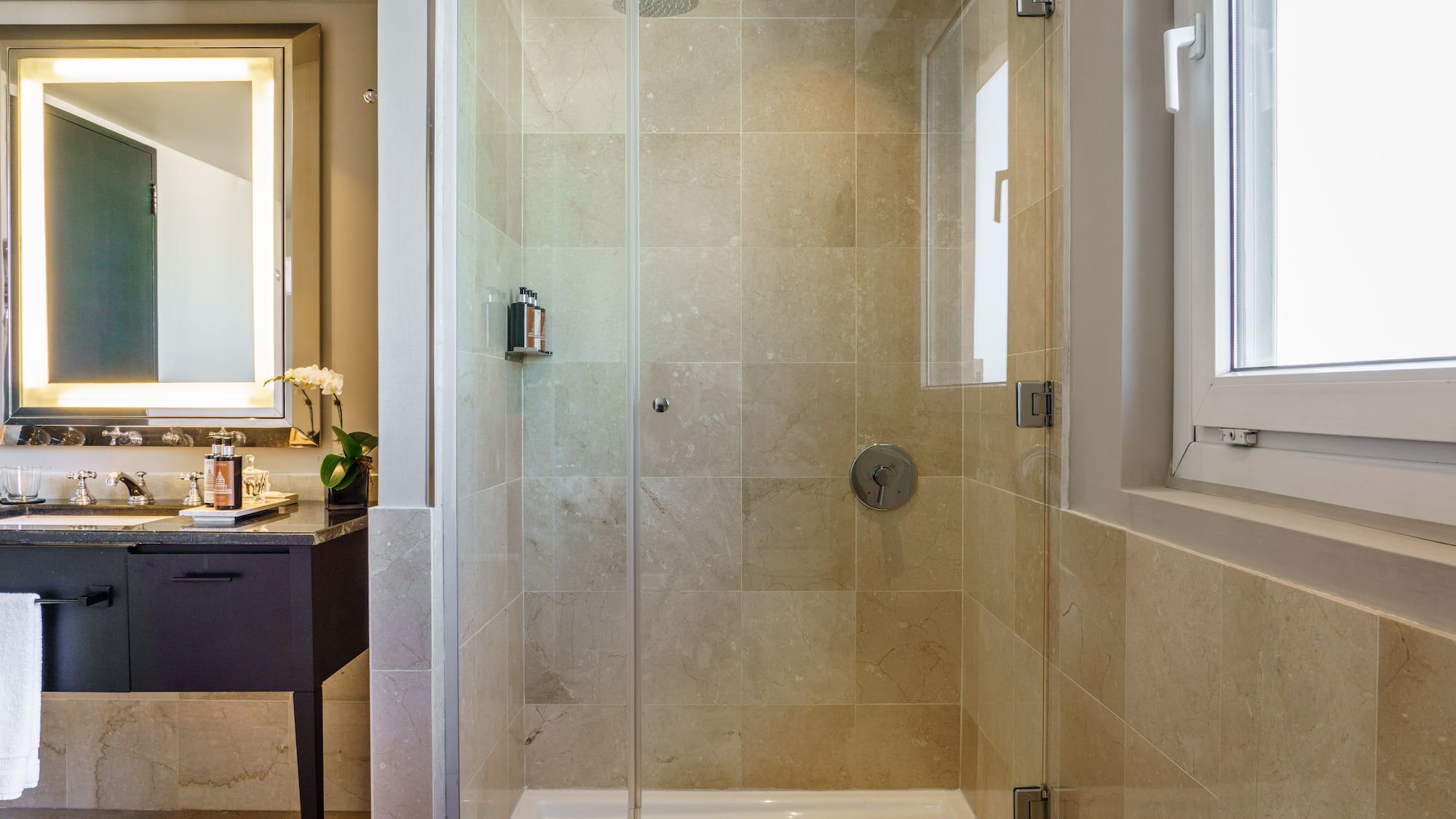 a shower with glass doors