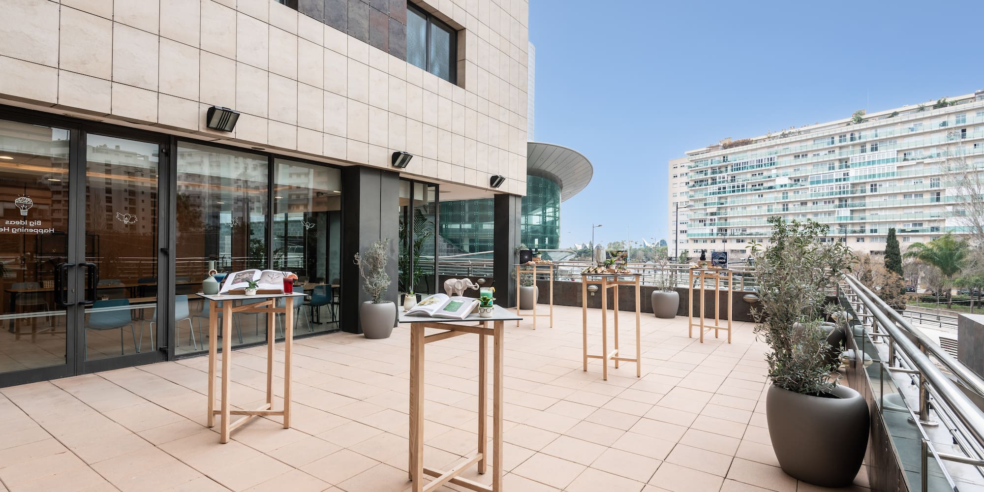 a building with a balcony and tables