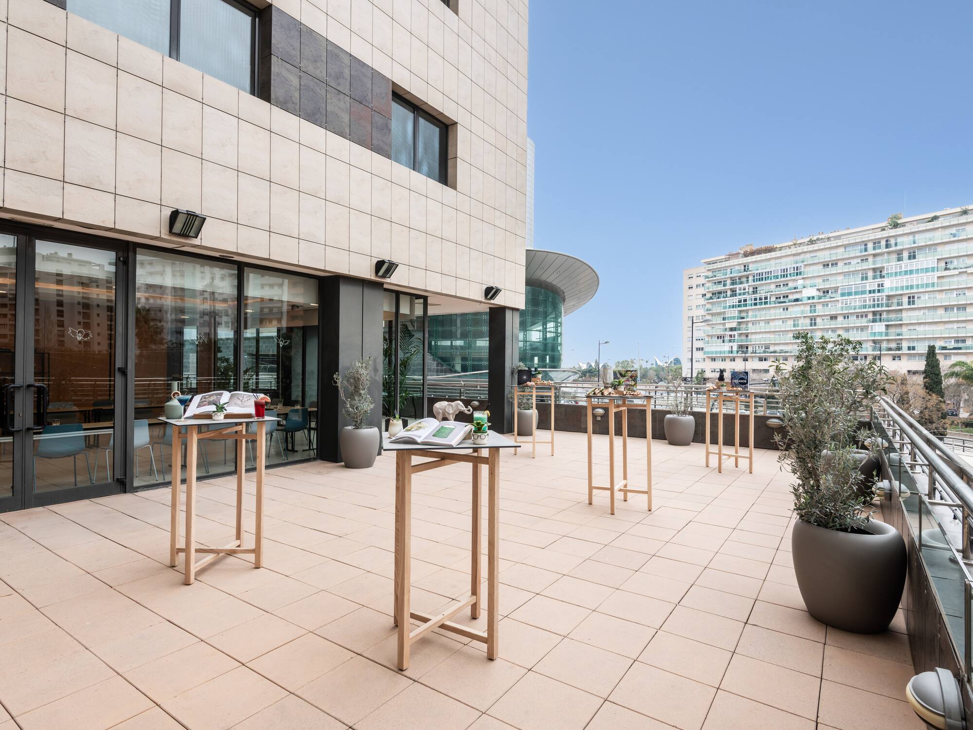 a building with a balcony and tables