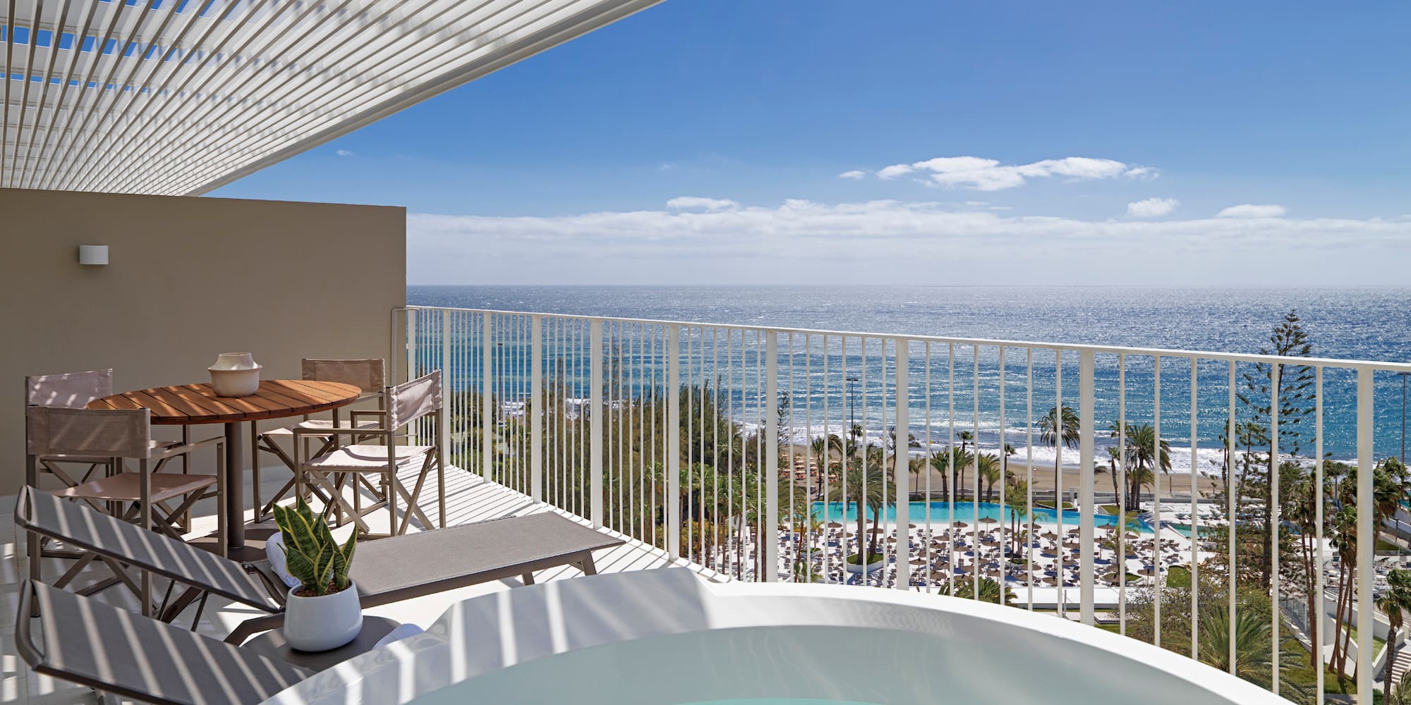 a hot tub with a view of the ocean