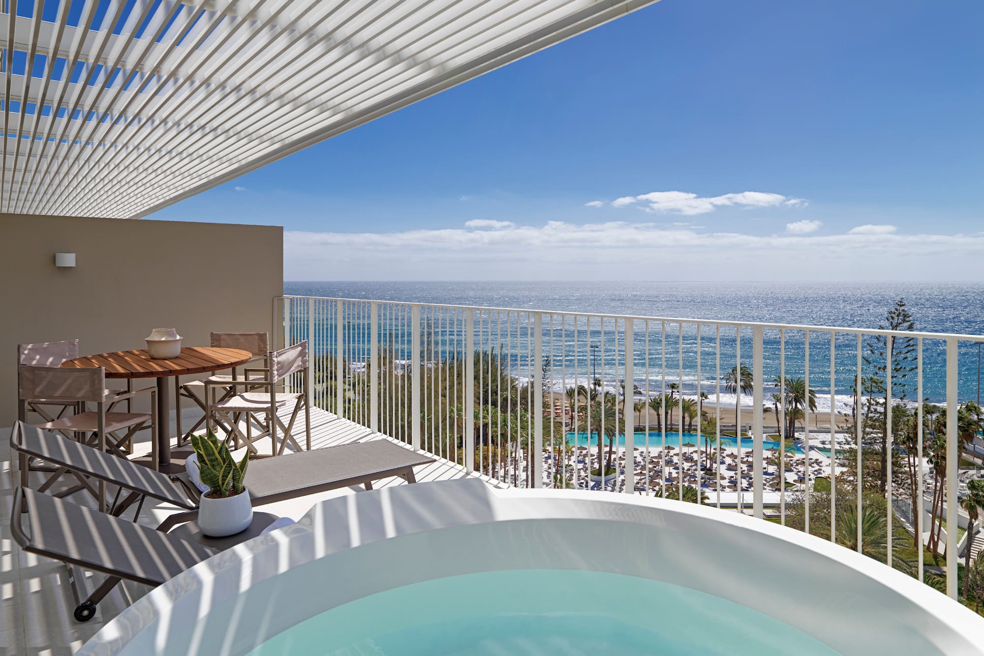 a hot tub with a view of the ocean