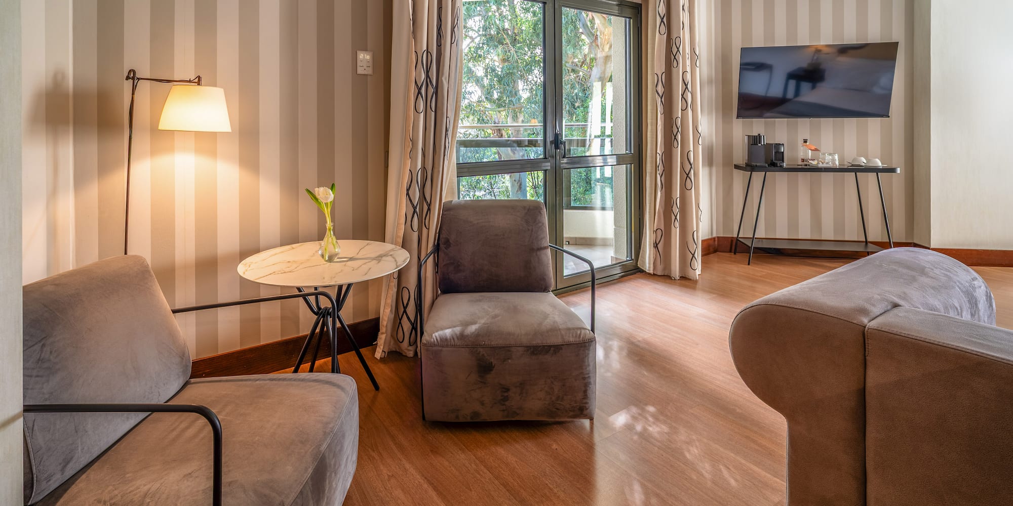 a room with two chairs and a television