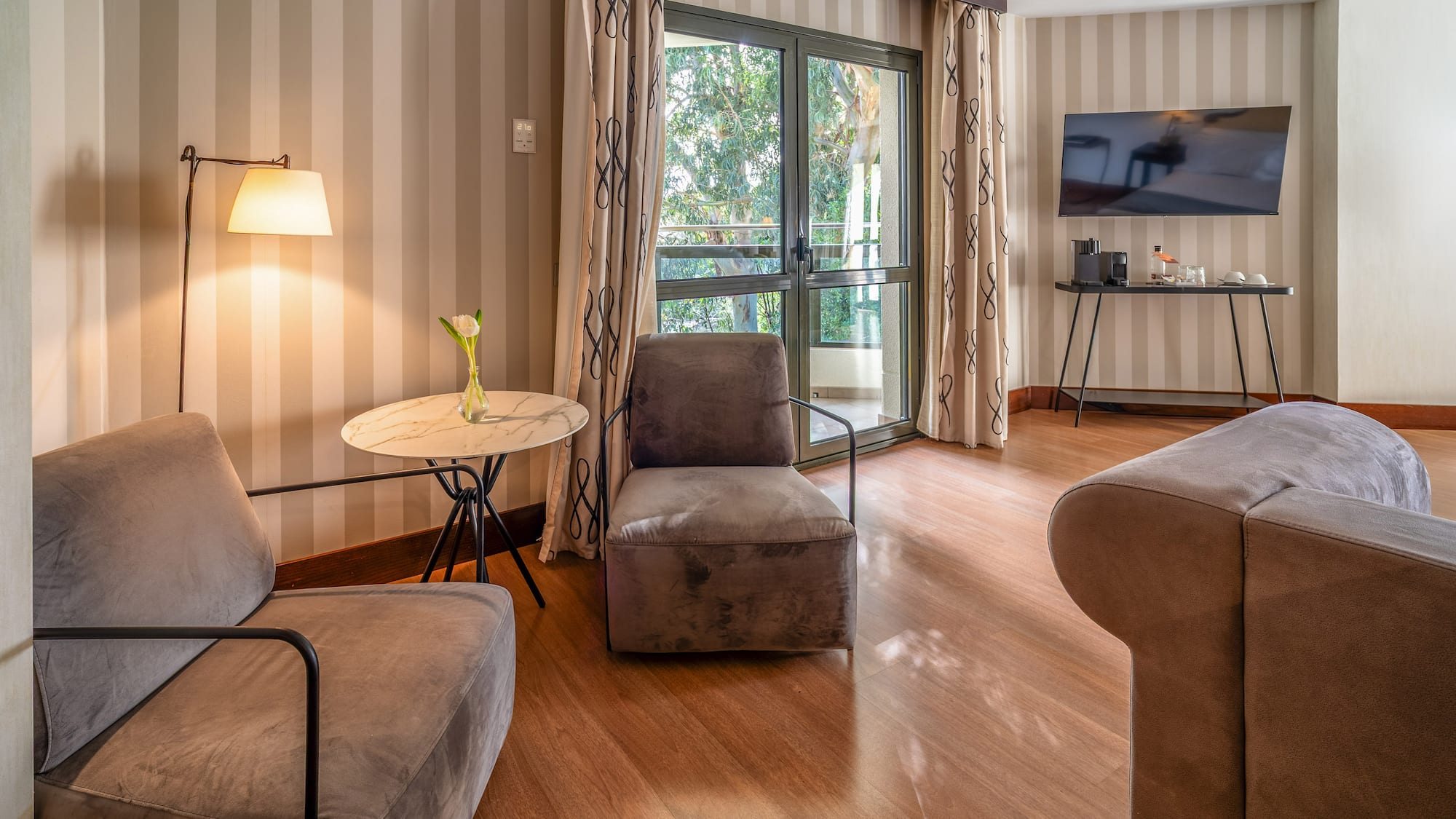 a room with two chairs and a television