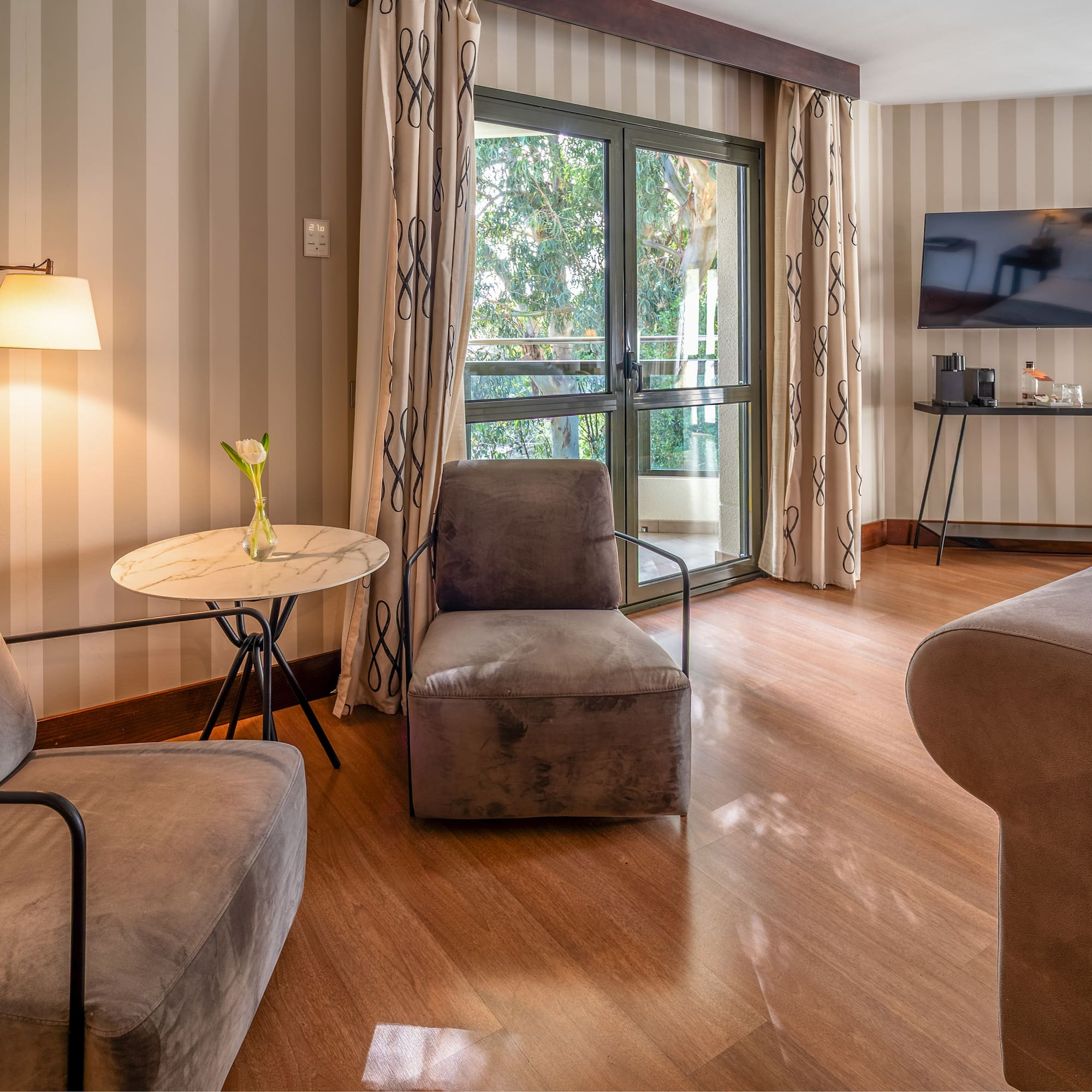 a room with two chairs and a television