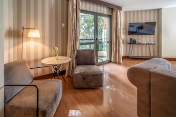 a room with two chairs and a television