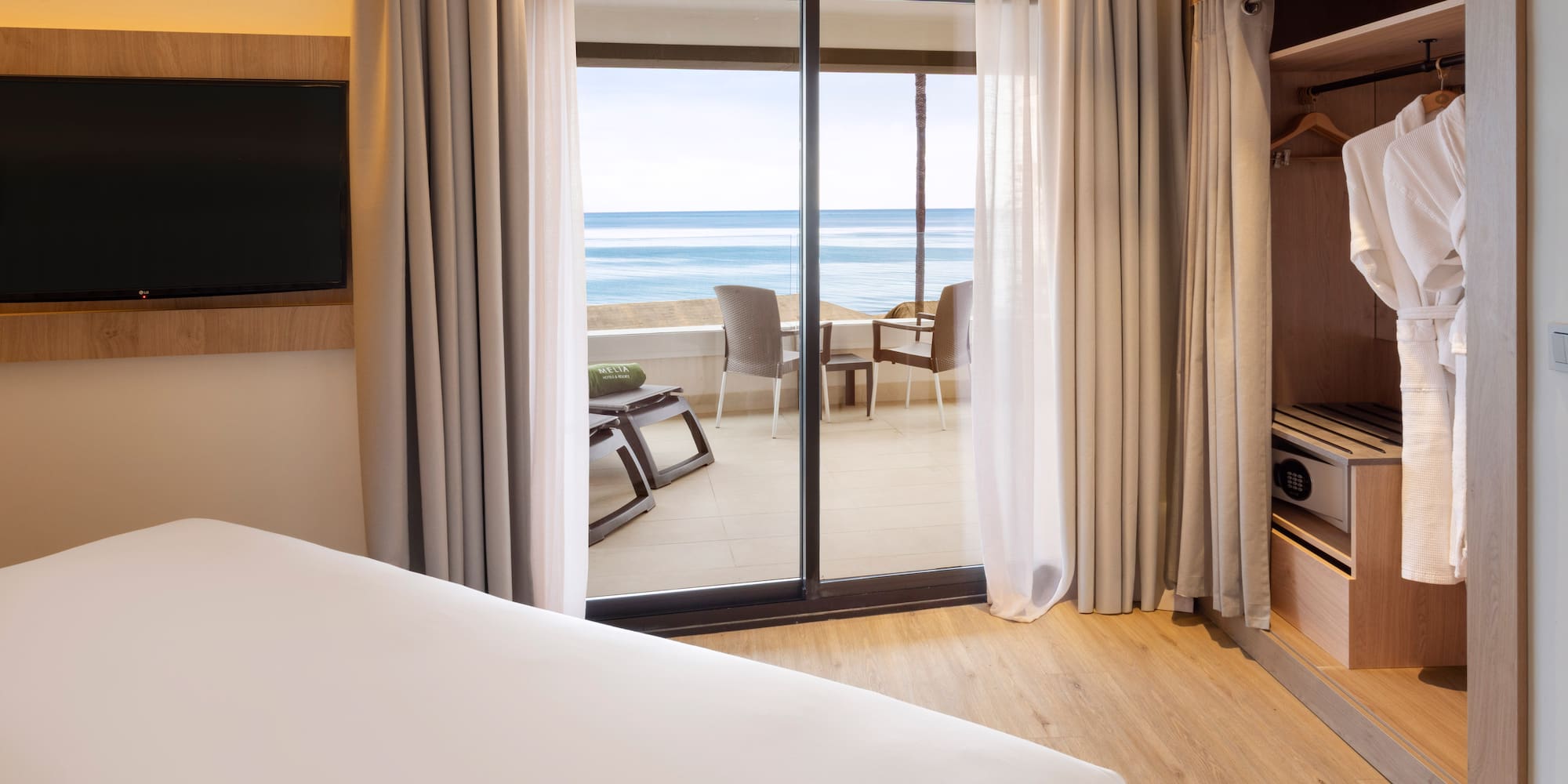 a room with a television and a bed