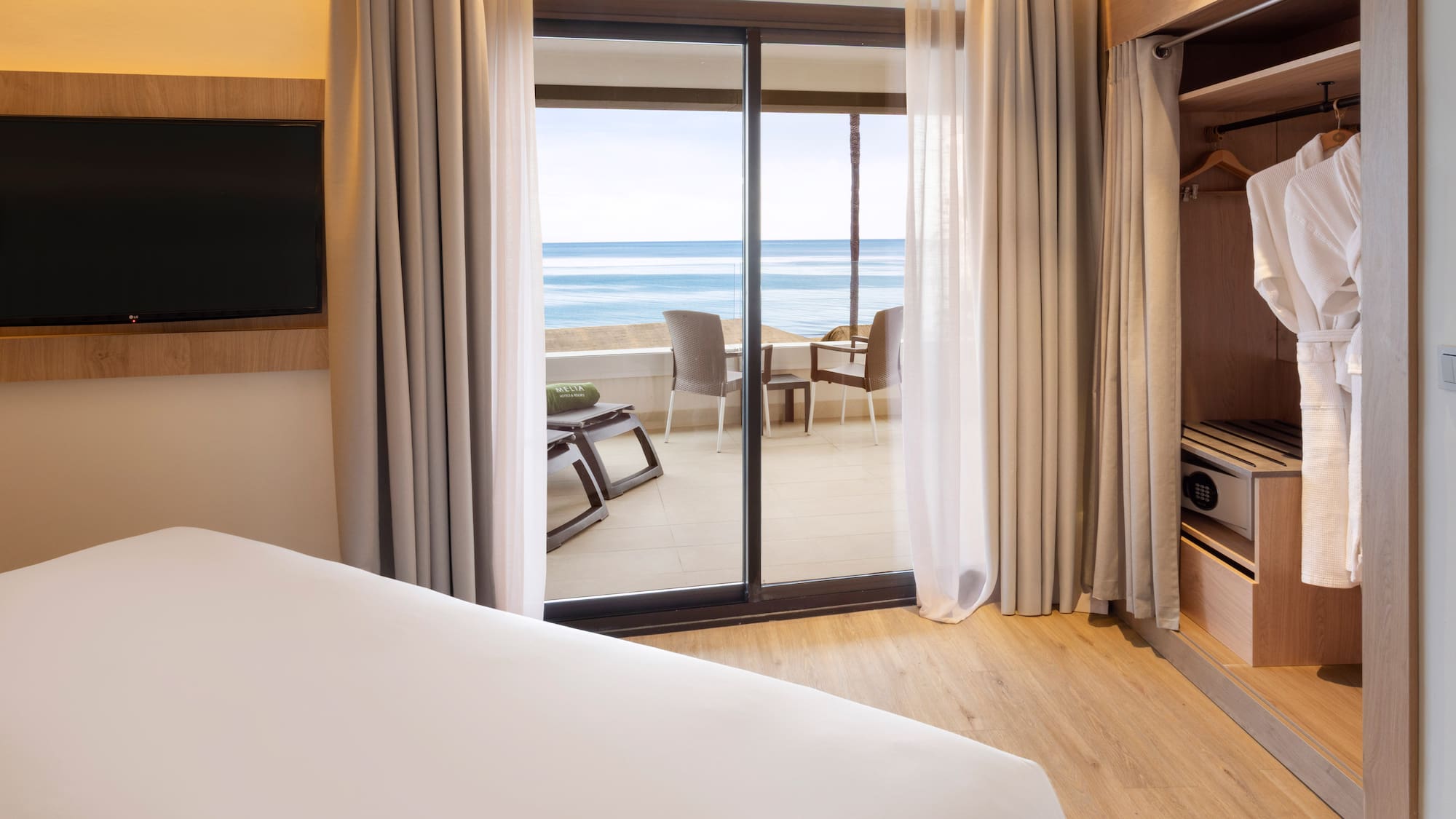 a room with a television and a bed